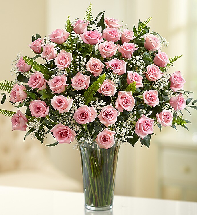 Ultimate Elegance™ Premium Long Stem Pink Roses arranged by a florist ...